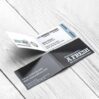 on wood background showing folding visiting card.